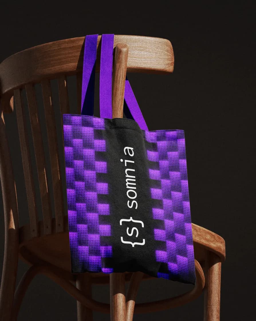Dithered purple Somnia tote bag on a wooden chair