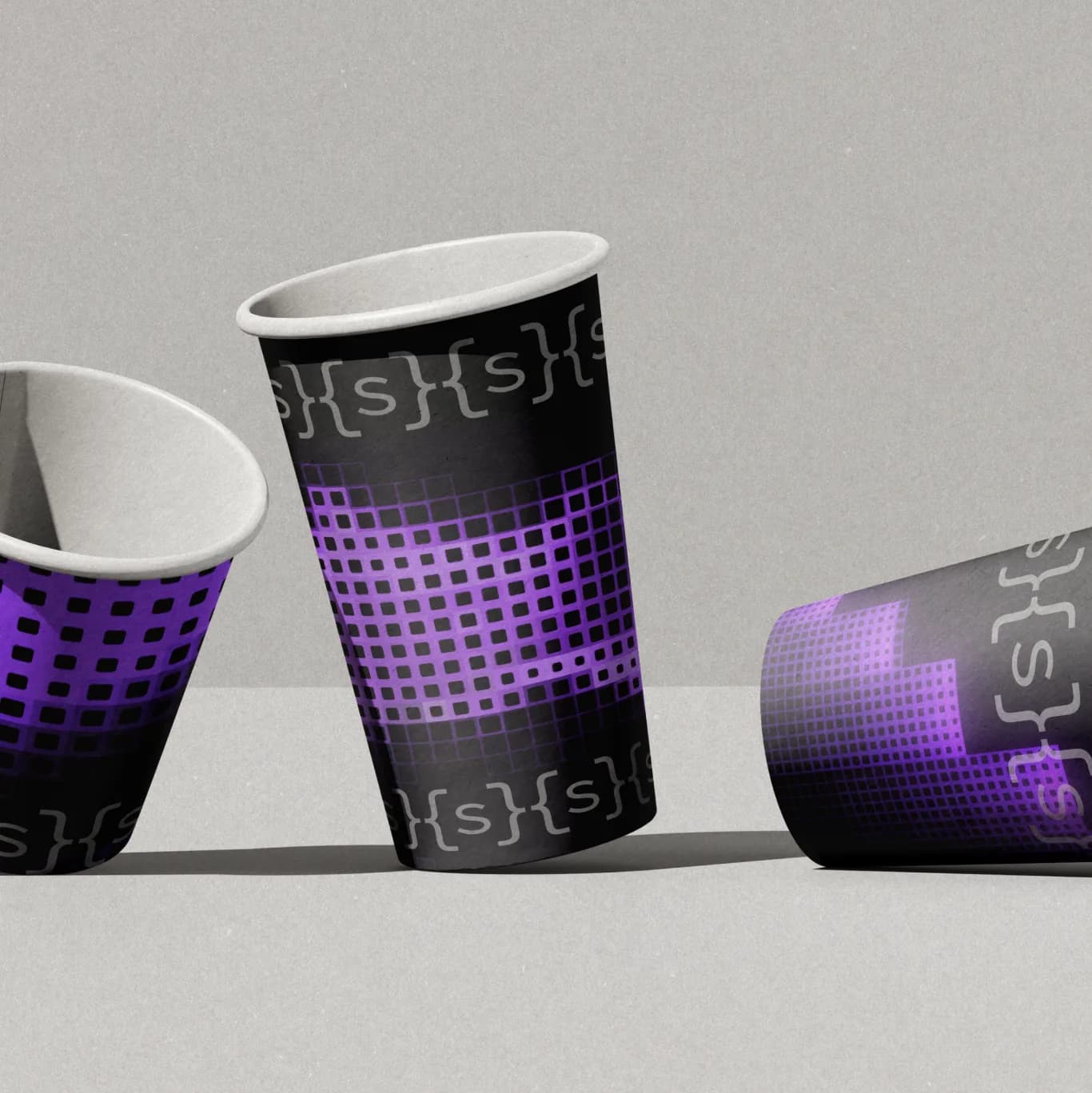 Somnia paper cups, the {s} mark round their rims
