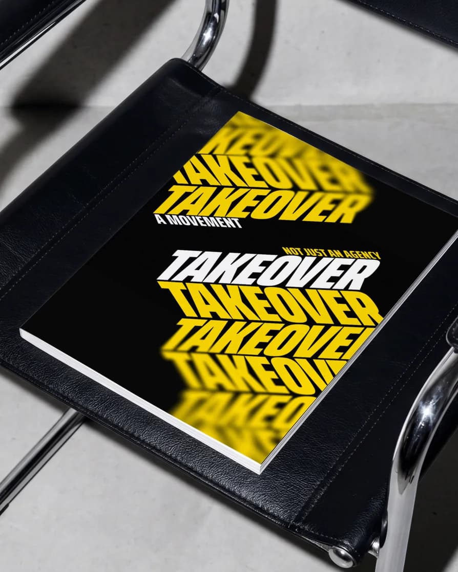 Takeover book on a black leather chair