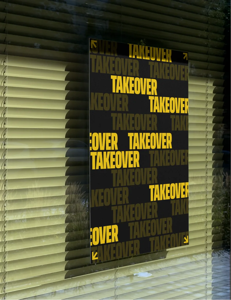 Takeover poster in a window, behind half-open blinds