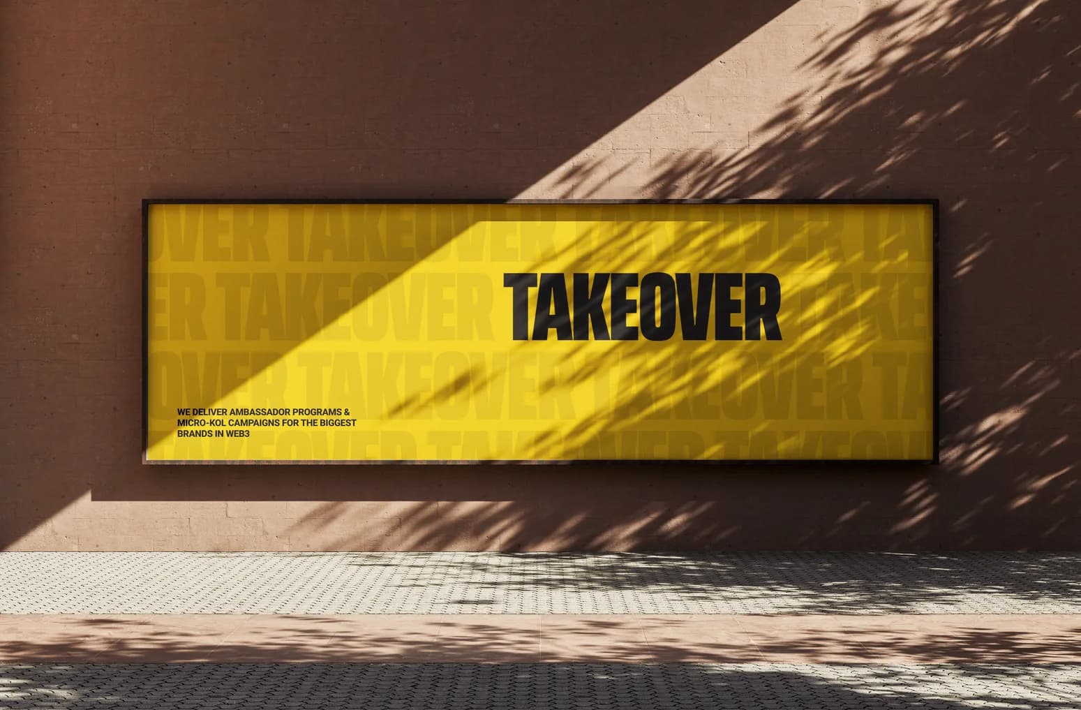 Takeover billboard on a brick wall in the sun, TAKEOVER over its own name repeating