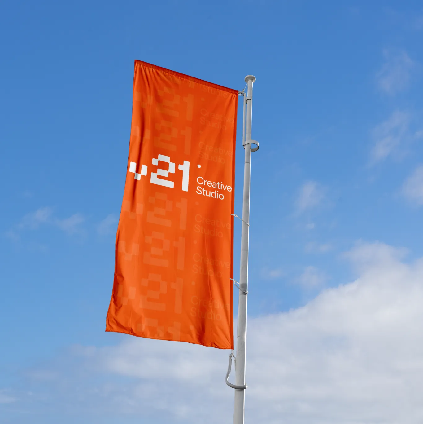 Orange V21 flag on a pole against the sky