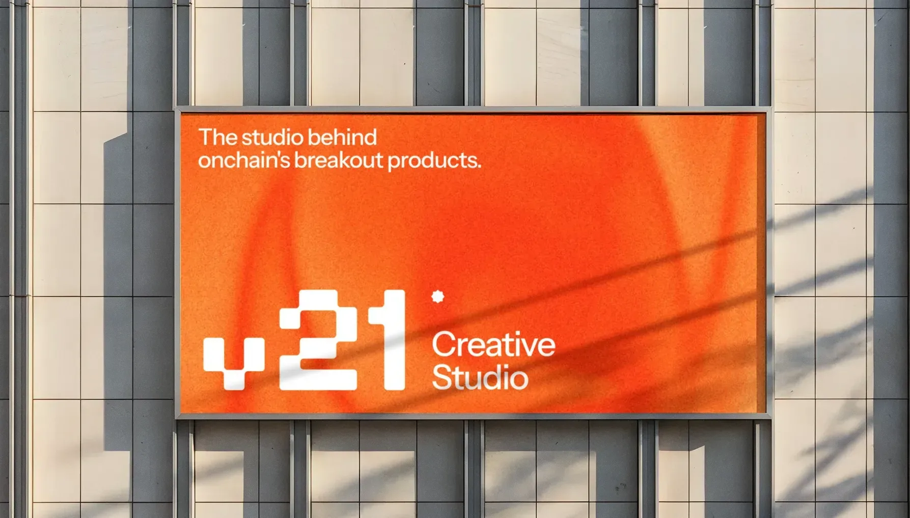 V21 billboard on a building: the studio behind onchain’s breakout products
