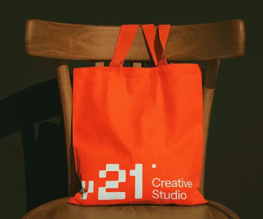 Orange V21 tote bag on a wooden chair