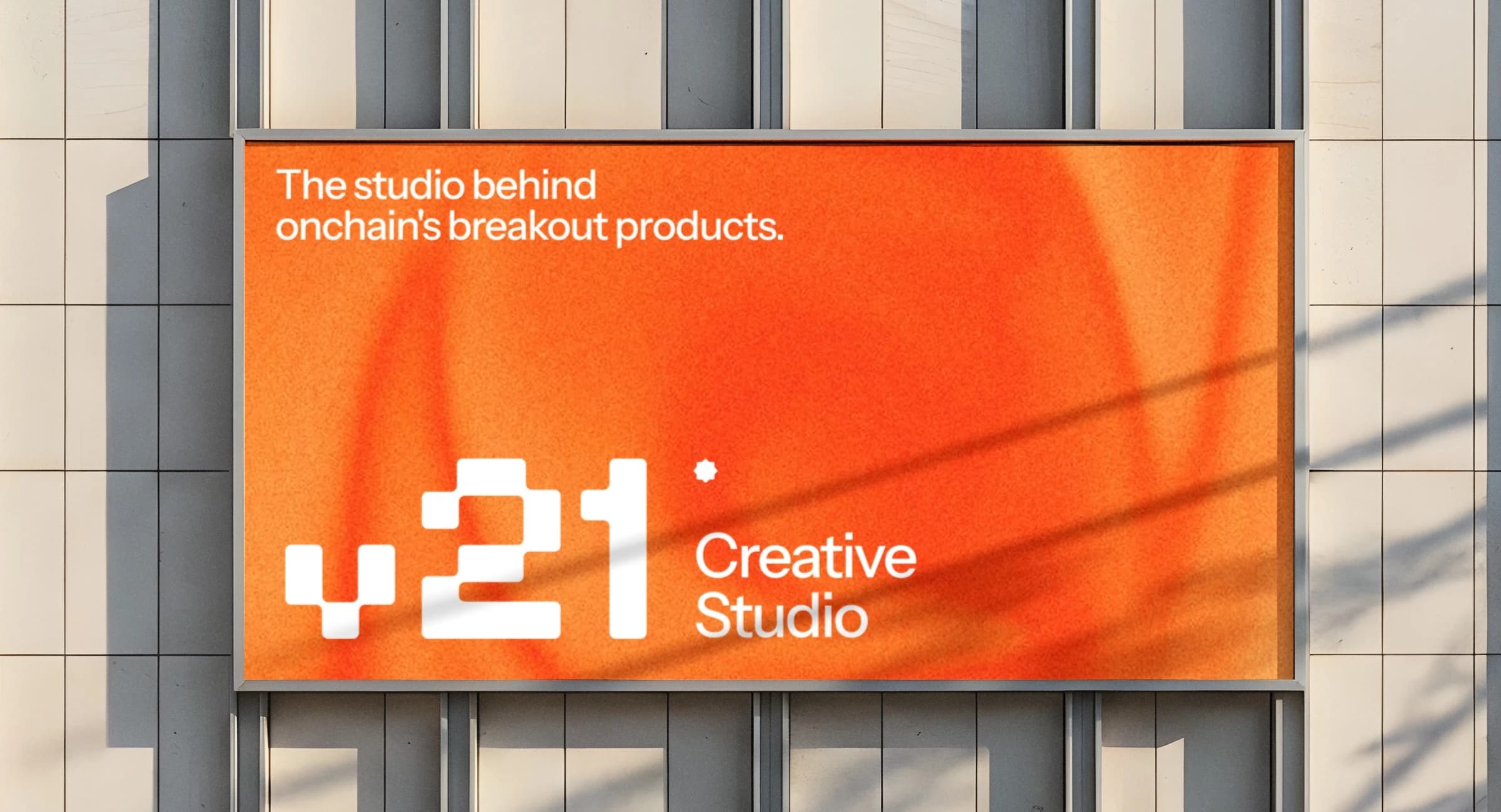 V21 Creative Studio billboard: the studio behind onchain’s breakout products